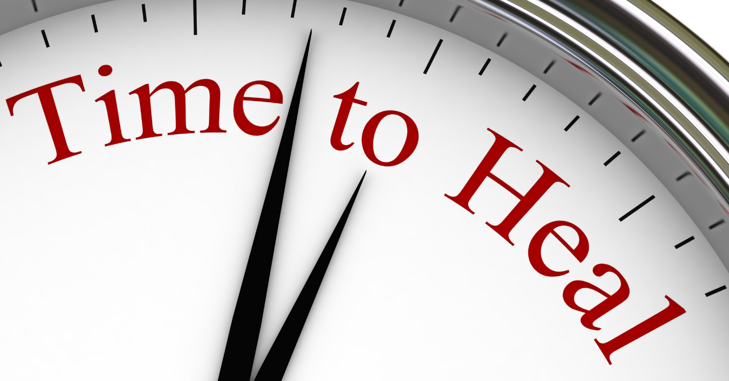 "White analog clock with red text reading 'Time to Heal' – representing the journey to chronic pain recovery with The Chronic Pain Blueprint."